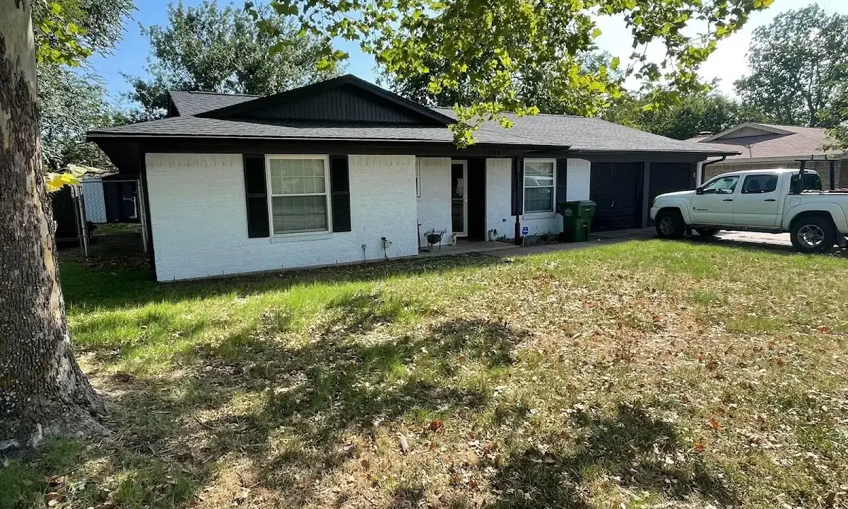 Professional roofing crew working on a residential roof in New Smyrna Beach